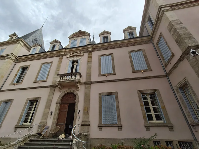 The main doorcase flanked by shuttered windows