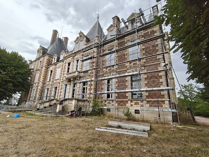 The brick wing under full restoration scaffolding