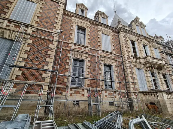 Scaffolding against the diamond brickwork
