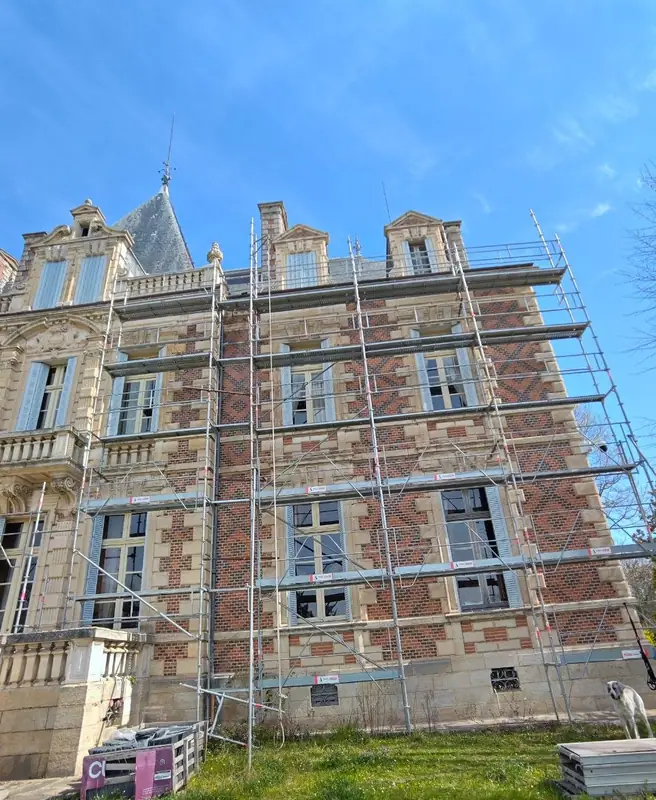 Scaffolding across the brick facade during restoration